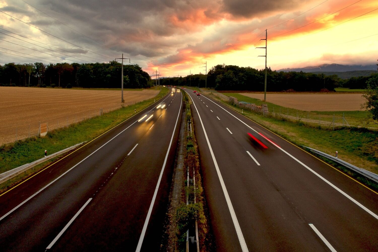 a motorway with a sunset